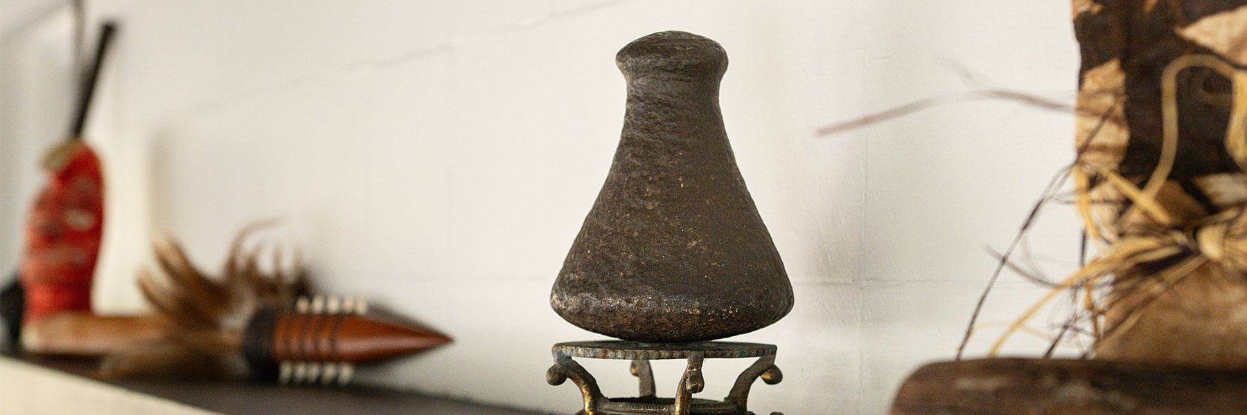 Stone object displayed on a mantle.